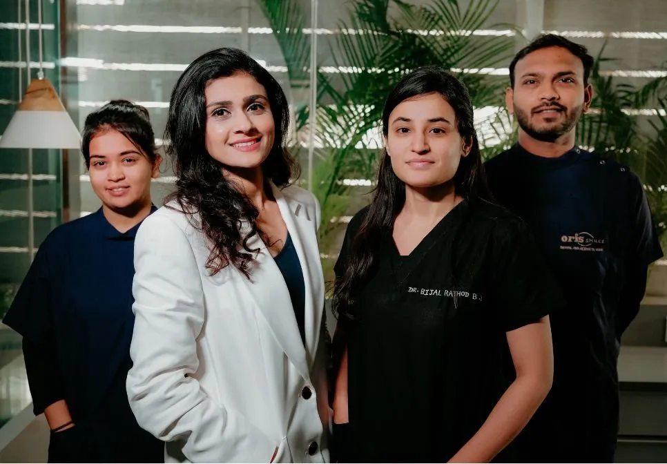 Oris Smiles dental team standing together at the clinic in Ahmedabad